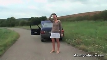A Cute Babe Allures Grandpa On The Road.