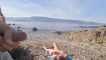 A Daring Man Reveals His Genitals To A Nudist Woman On The Beach, Who Proceeds To Perform Oral Sex In This Explicit Video